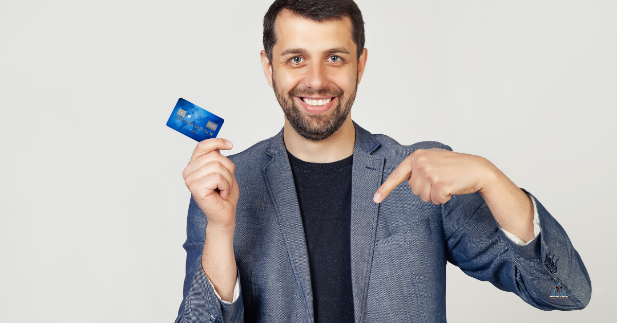 Man measuring his face with a credit card to determine eyeglass frame size.